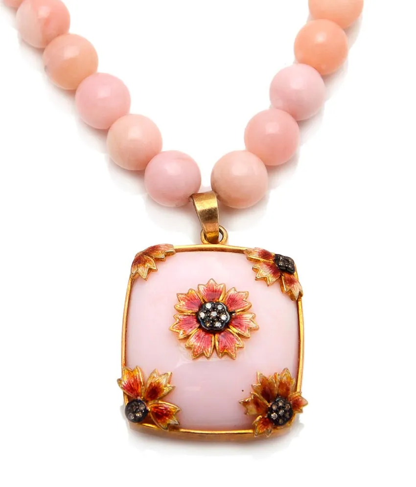 Close view of a pink opal cushion pendant with enamel sunflowers, on pink bead strand