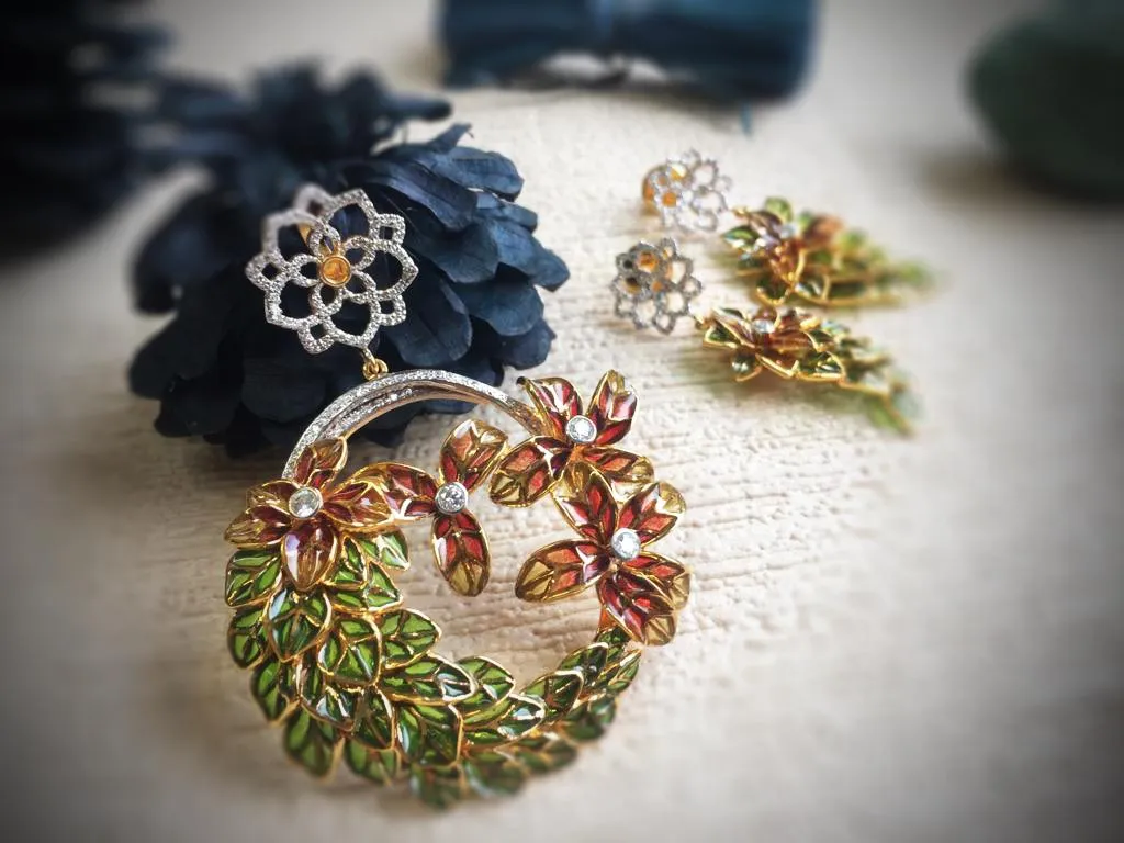 Wreath pendant of russet and olive translucent enamel leaves with diamond florets, and earrings