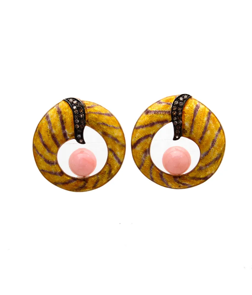 Rope-textured hoop earrings in amber enamel holding a pink ball at the centre