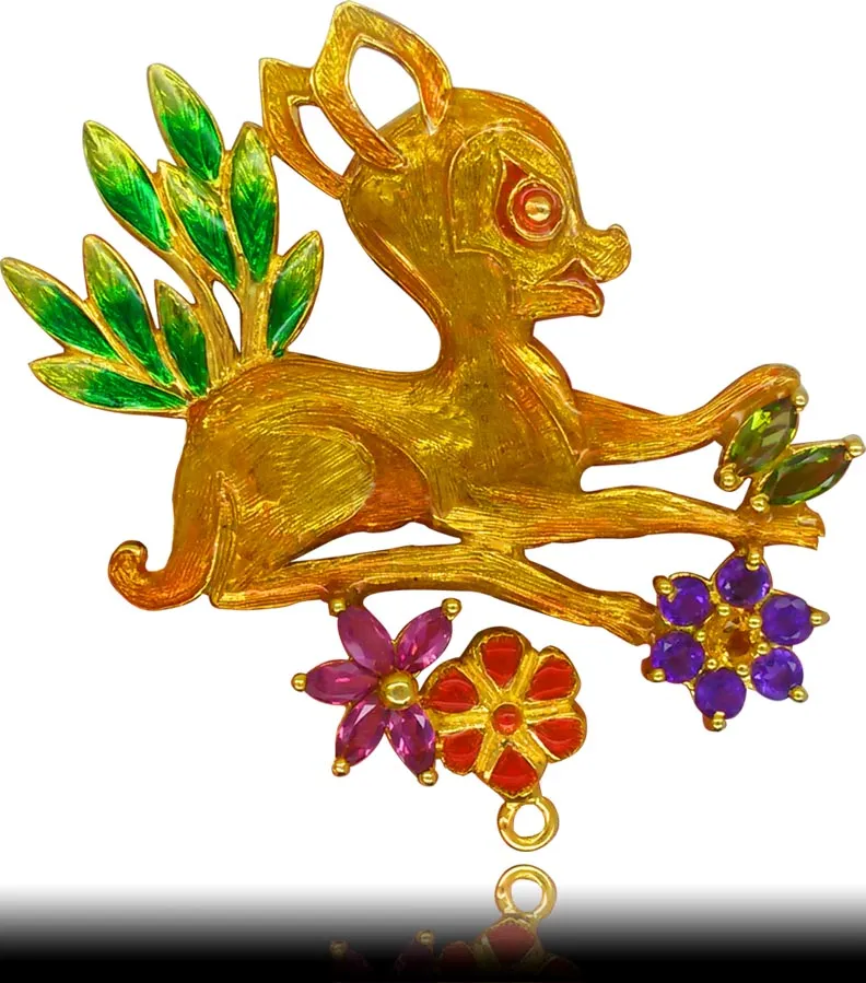 Pendant of a leaping deer in gold tone over purple and green enamel flowers