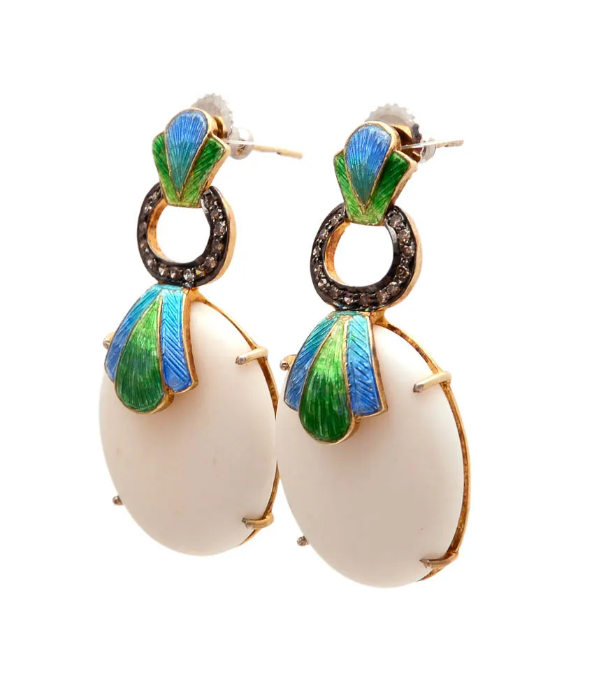 Earrings with large white oval cabochon drops below blue-green enamel tops
