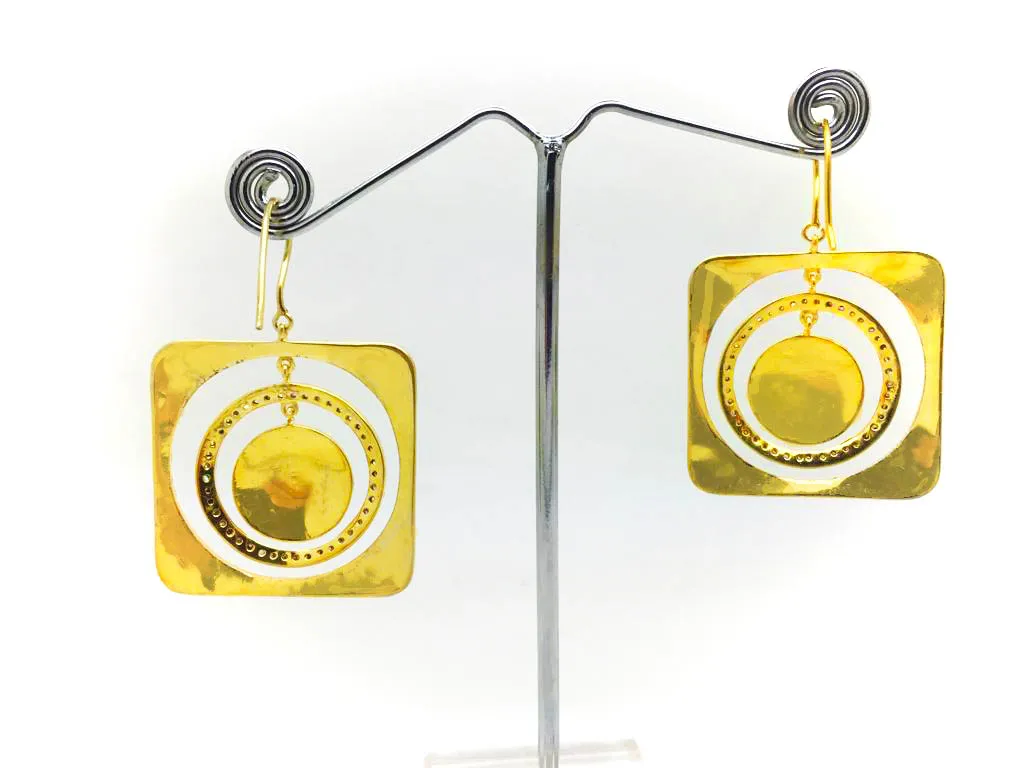Citrus square earrings on a display stand, showing the cut-out concentric rings and pavé circle