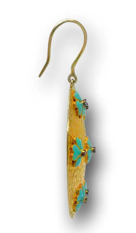 Turquoise blossom disc earring seen edge-on