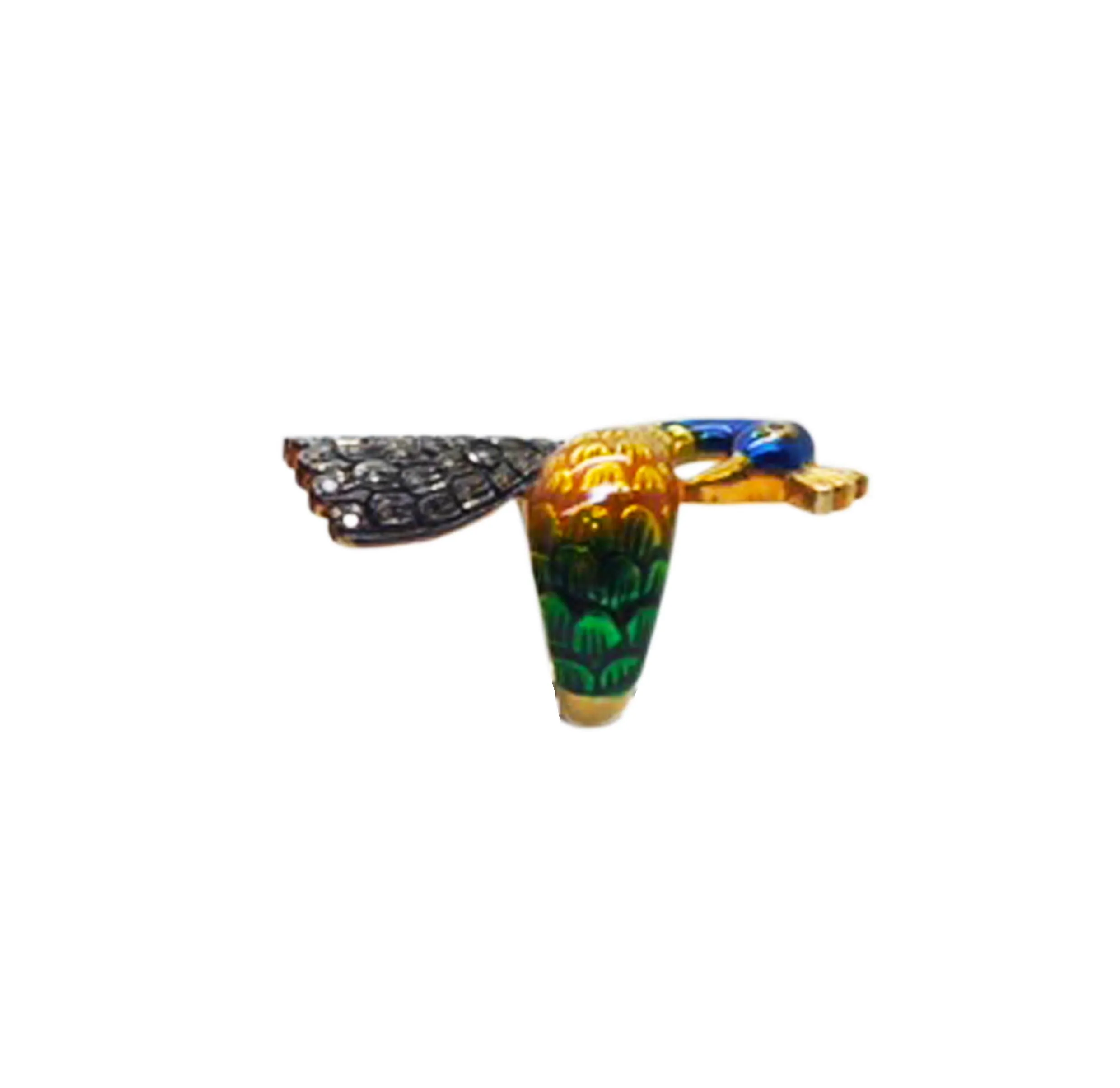 Peacock head ring photographed against white, tail feathers visible